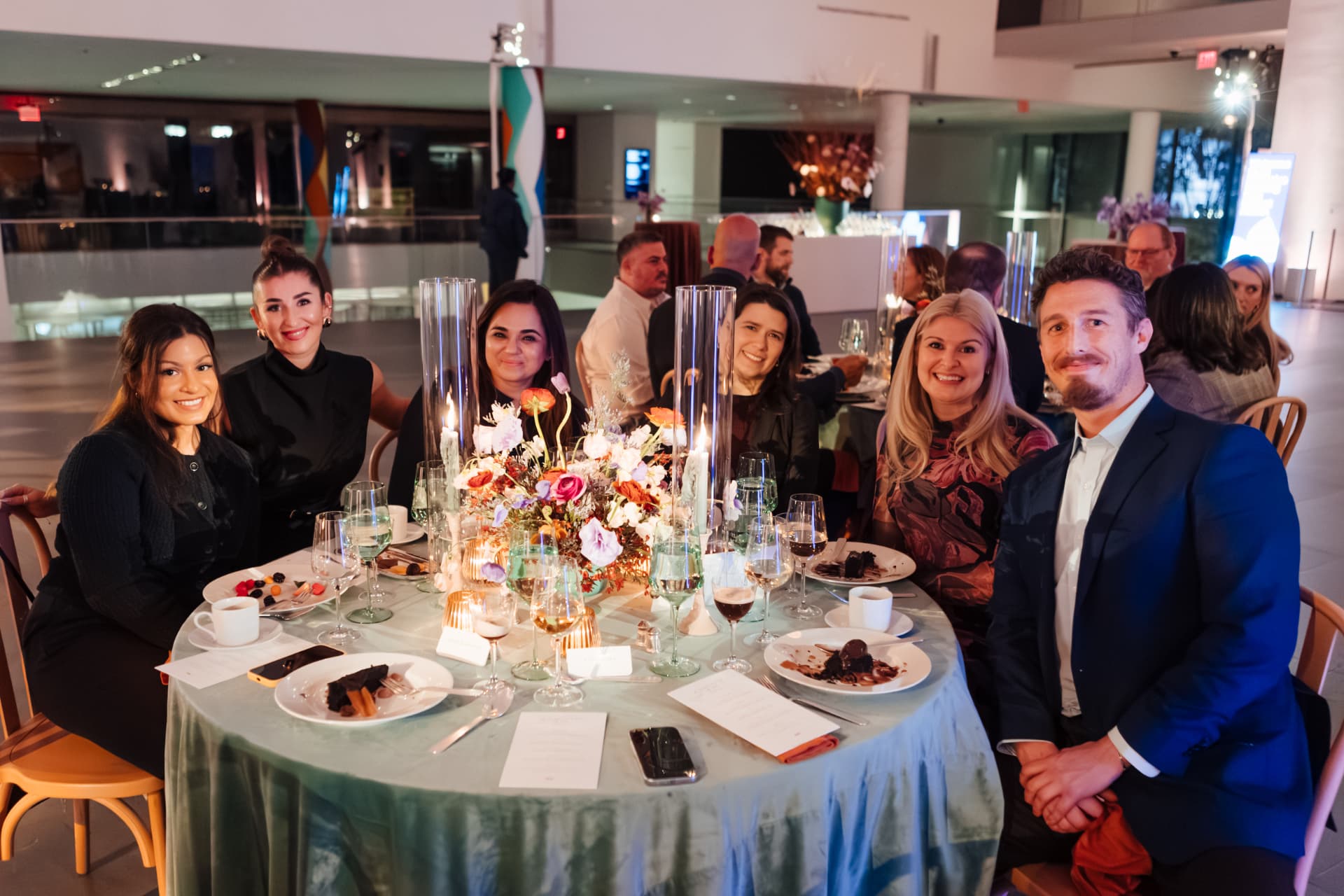 Guests gathered around a dinner table at MoMA
