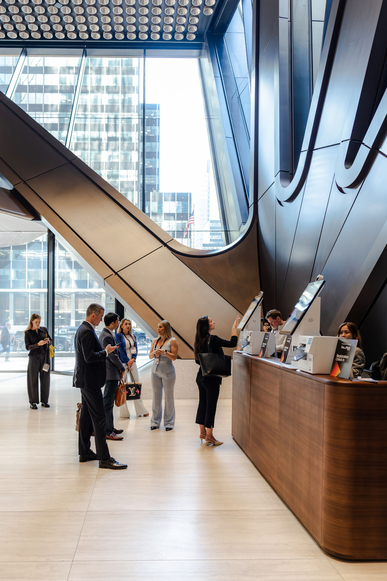 Guests arriving at registration in the J.P. Morgan lobby in New York