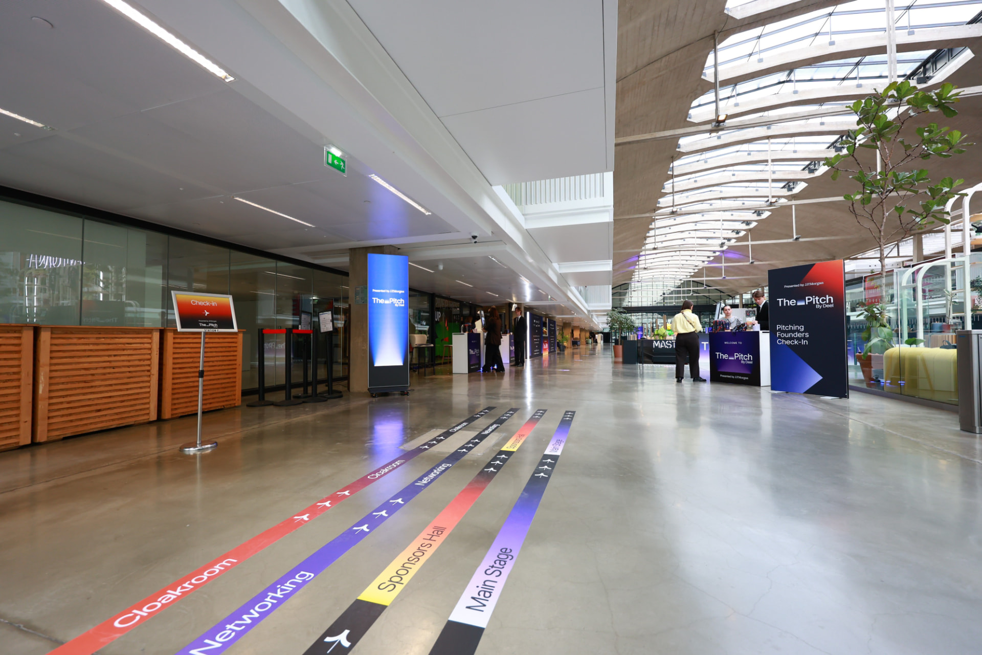 Branded wayfinding lines guiding guests through STATION F
