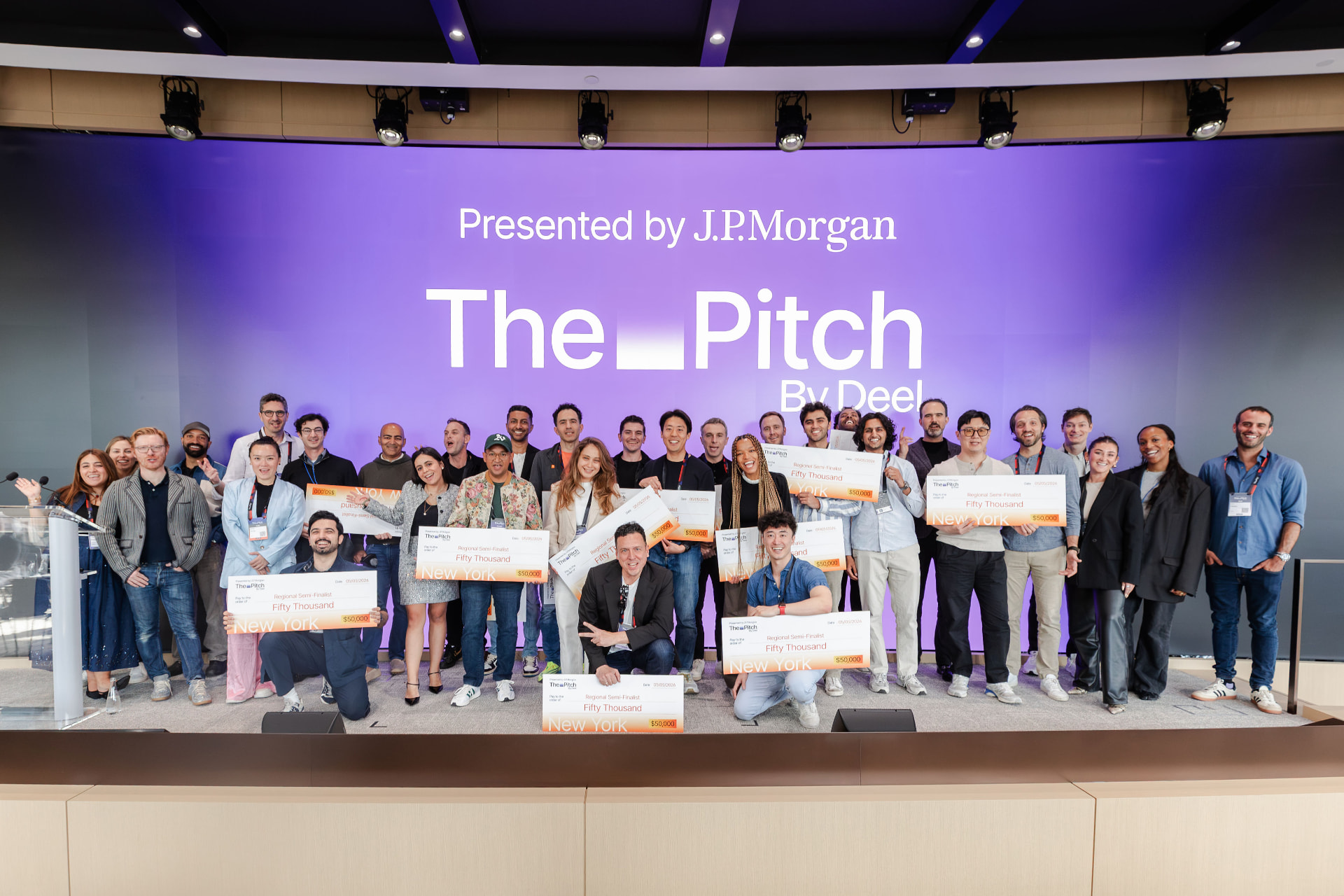 New York semi-finalists and the wider group on stage at the close of the event