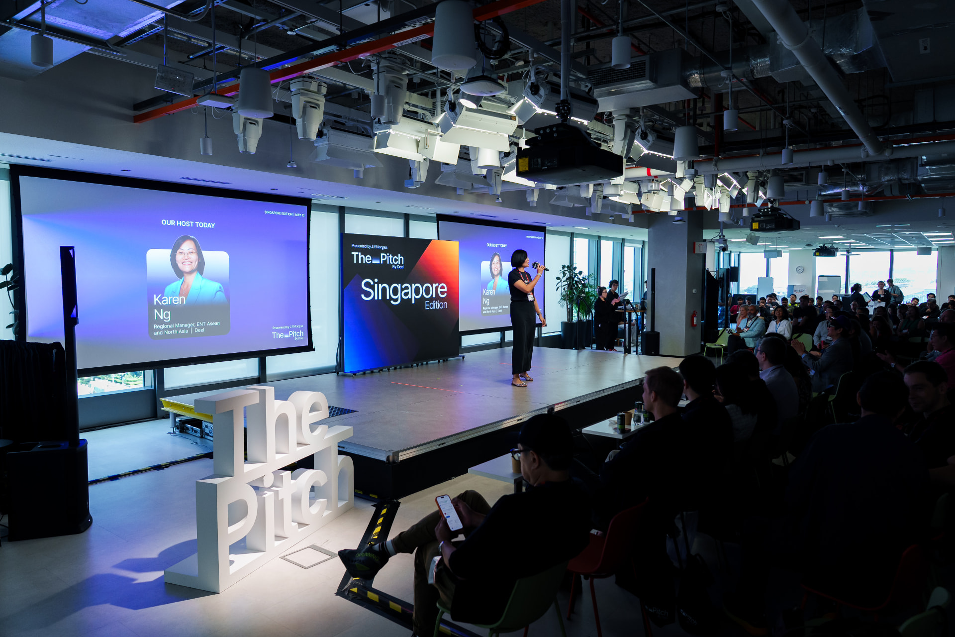 The Singapore Edition stage at the AWS offices with the host opening the event