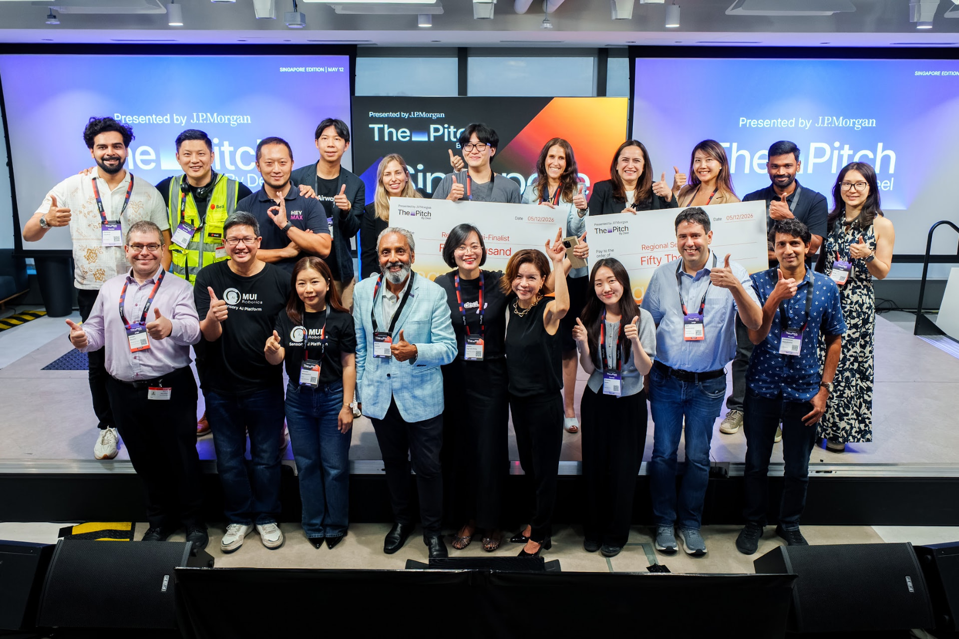 Founders, judges and the Deel team gathered on stage at the Singapore Edition