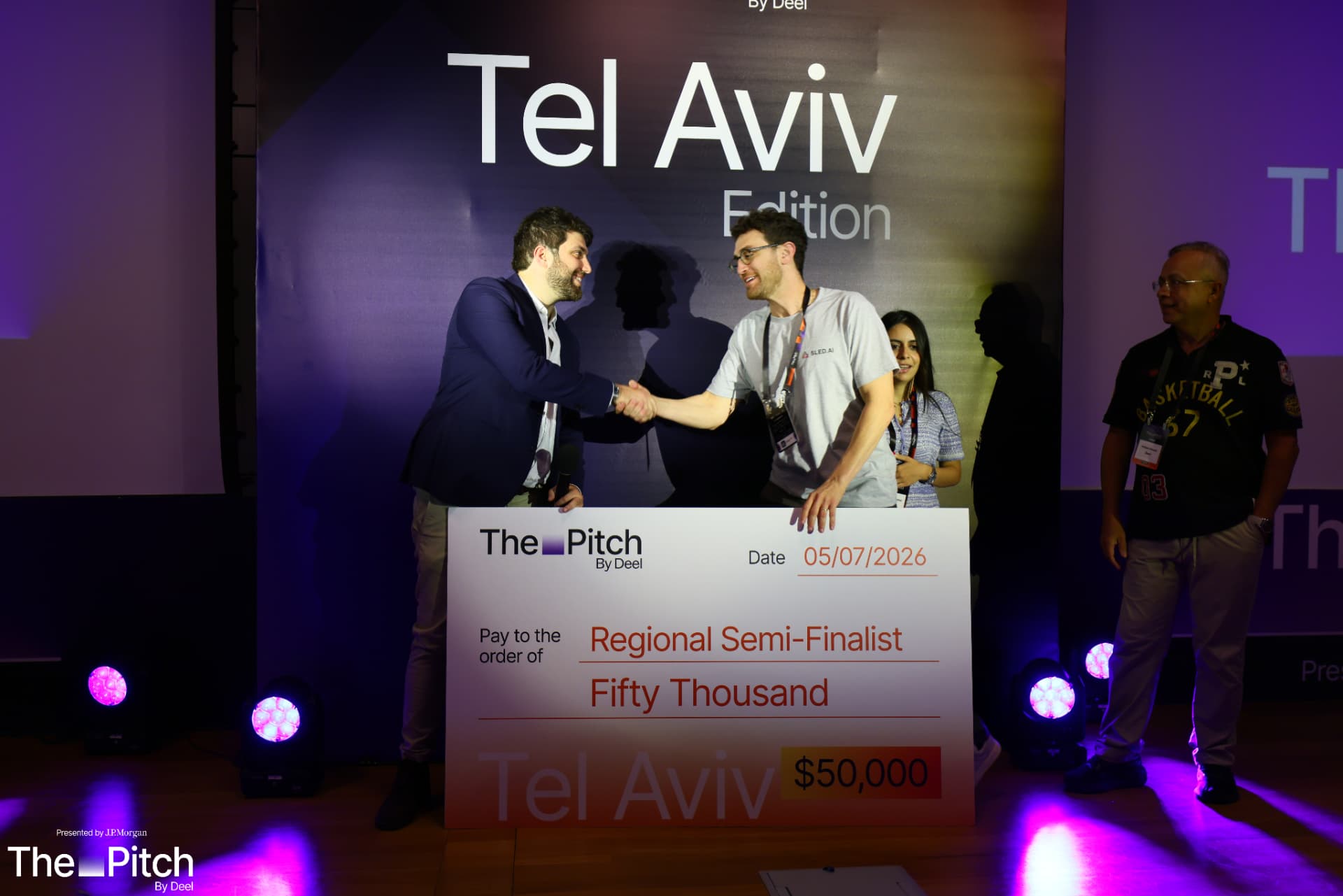 A regional semi-finalist receiving their cheque on the Tel Aviv Edition stage