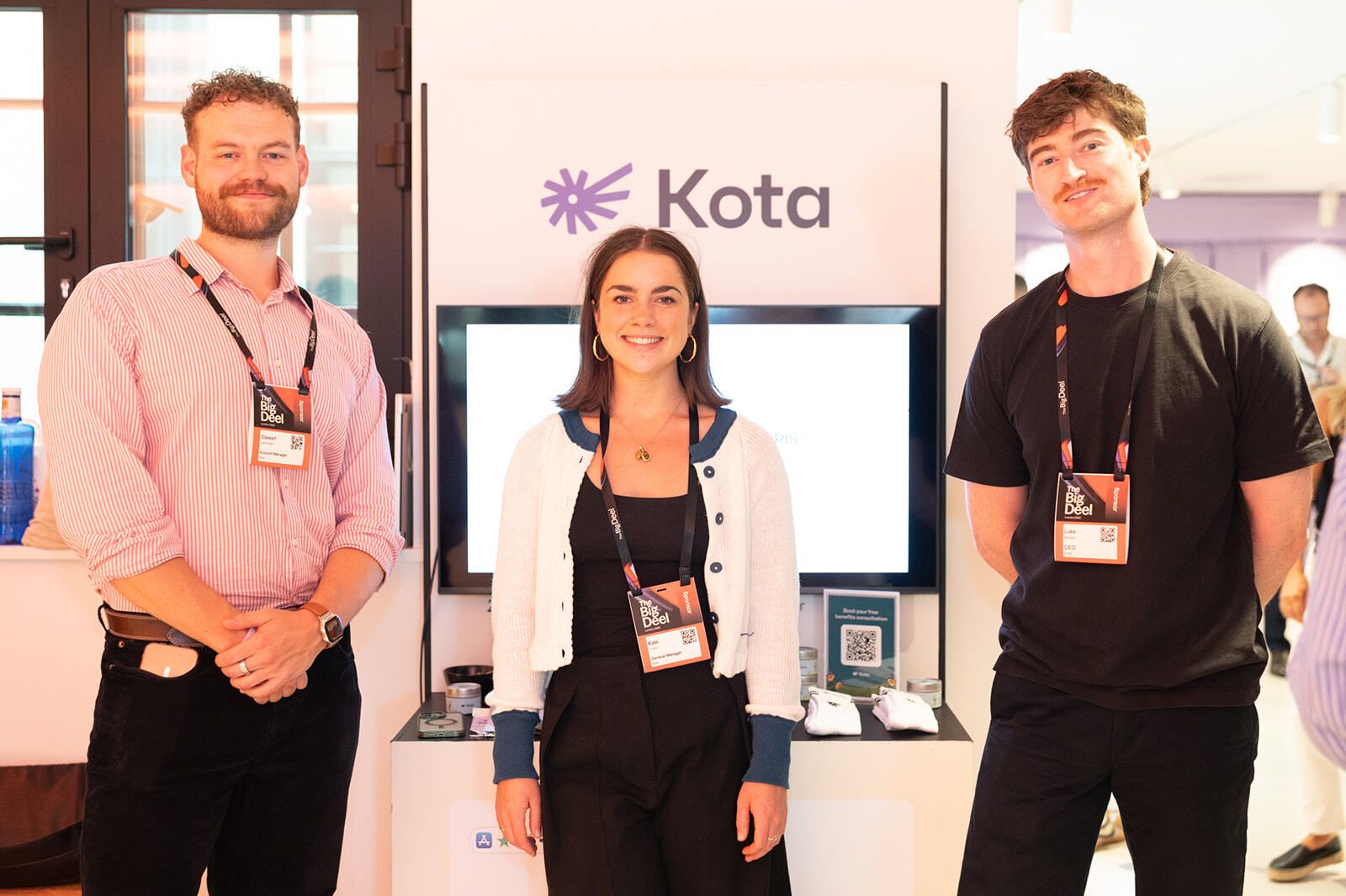 Partner team at their branded stand inside Town Hall
