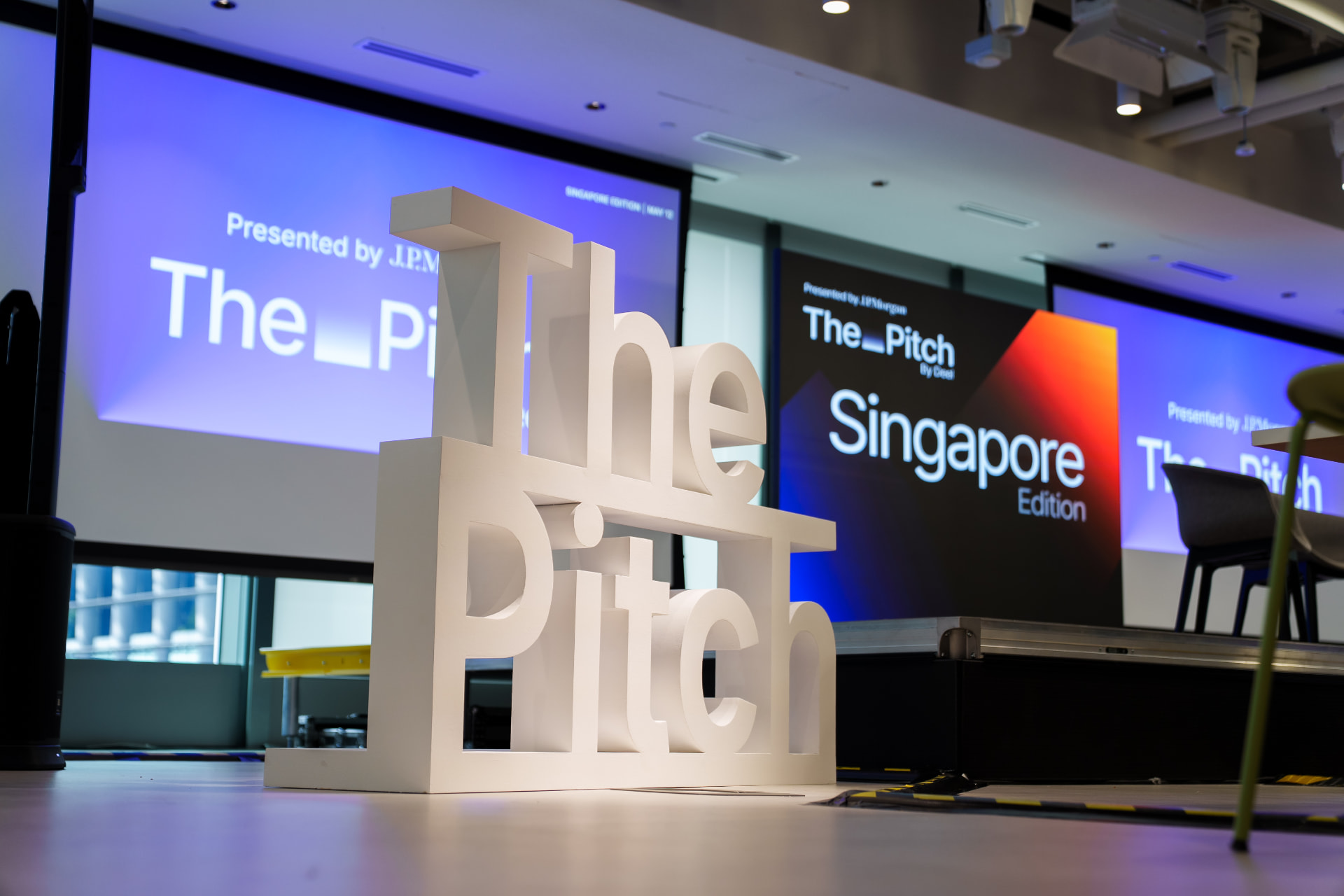 The Pitch sculptural letters in front of the Singapore Edition screens